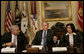 President George W. Bush is joined by Walter Isaacson, President and CEO, Aspen Institute, and Tahani Abu Daqqa, Palestinian Minister of Youth and Sports, during a meeting Monday, Dec. 3, 2007, with U.S.-Palestinian Public-Private Partnership in the Roosevelt Room of the White House. The partnership is aimed at promoting economic opportunity and leadership development for Palestinian youth. White House photo by Eric Draper