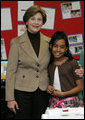 Mrs. Laura Bush embraces 10-year-old Taylor Rice, whose father is currently serving overseas in the Army Reserves, during a visit to the Learning Center at Andrews Air Force Base in Maryland, Wednesday, Dec. 5, 2007, where Mrs. Bush participated is a roundtable discussion on the special needs of military youth and families. White House photo by Joyce N. Boghosian