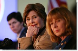 Mrs. Laura Bush listens to panel members during her participation is a roundtable discussion on the special needs of military youth and families Wednesday, Dec. 5, 2007, at the Learning Center at Andrews Air Force Base in Maryland. White House photo by Joyce N. Boghosian