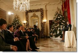 President George W. Bush delivers remarks during the Menorah lighting Monday, Dec. 10, 2007, in the Grand Foyer of the White House. Said the President, "Laura and I wish people of Jewish faith around the world a happy Hanukkah. May God bless you all." White House photo by Chris Greenberg