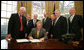 President George W. Bush signs into law H.R. 1429, the Improving Head Start for School Readiness Act of 2007, in the Oval Office Wednesday, Dec. 12, 2007. Members of Congress looking on are, from left: California Rep. George Miller; Michigan Rep. Dale Kildee; Sen. Ted Kennedy, D-Mass.; Delaware Rep. Mike Castle; Sen. Lamar Alexander, R-Tenn.; Sen. Mike Enzi, R-Wyo., and California Rep. Buck McKeon. White House photo by Chris Greenberg