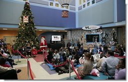 Mrs. Laura Bush reads "Rudolph the Red Nosed Reindeer" to children at the Children's National Medical Center in Washington, D.C., Wednesday, Dec. 12, 2007, following a tour of the Surgical Care Unit where she visted with young patients. White House photo by Shealah Craighead