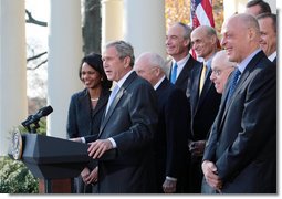 President George W. Bush, joined by Vice President Dick Cheney and members of his Cabinet, speaks with reporters in the Rose Garden, Friday, Dec. 14, 2007, where President Bush congratulated the Senate for passing a good energy bill, and urged Congress to move forward with spending legislation to fund the day to day operations of the federal government. President Bush also said he hoped those members of the press who attended a White House press reception Thursday evening had a good time, and joked that some silverware might be missing. White House photo by Eric Draper