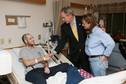 President George W. Bush visits U.S. Navy Hospital Corpsman Christopher Braley and his mother, Debra Braley, of Manteca, Calif., at the National Naval Medical Center in Bethesda, Md., Wednesday, Dec. 19, 2007. Braley is recovering from injuries sustained in Operation Iraqi Freedom. White House photo by Joyce N. Boghosian