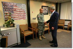 President George W. Bush presents the Purple Heart medal to US Army PFC Jeddah DeLoria of Chosen, Colo., Thursday, Dec. 20, 2007 at the Walter Reed Army Medical Center in Washington, D.C. DeLoria is recovering from injuries sustained in Operation Enduring Freedom in Afghanistan. White House photo by Joyce N. Boghosian