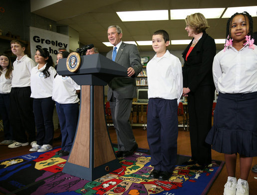 President George W. Bush visits with students Monday, Jan. 7, 2008, at the Horace Greeley Elementary School in Chicago, joined by U.S. Secretary of Education Margaret Spellings, right, where President Bush also delivered a statement highlighting the successes of No Child Left Behind and urged Congress to reauthorize it. White House photo by Joyce N. Boghosian