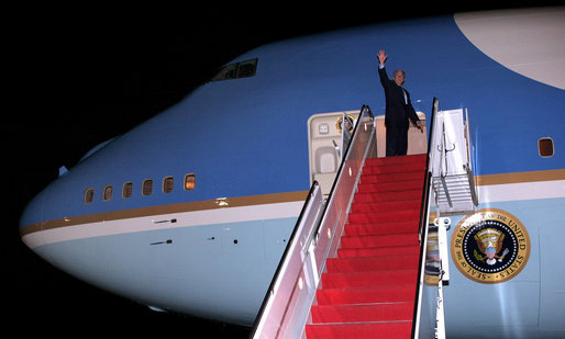 President George W. Bush waves as he boards Air Force One Tuesday, Jan. 8, 2008, at Andrews Air Force Base, en route to an eight-day visit in the Mideast. White House photo by Eric Draper