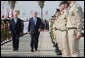 President George W. Bush and Israel’s Shimon Peres review the troops during an arrival ceremony Wednesday, Jan. 9, 2008, at Ben Gurion International Airport. President Bush arrived in Tel Aviv on the first stop of his eight-day, Mideast visit. White House photo by Eric Draper