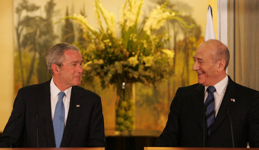 President George W. Bush listens as Prime Minister Ehud Olmert of Israel commends him Wednesday, Jan 9, 2008, during their joint press availability in Mr. Olmert’s Jerusalem office. White House photo by Chris Greenberg