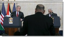 President George W. Bush and President Mahmoud Abbas of the Palestinian Authority, listen to a reporter’s question Thursday, Jan. 10, 2008, during a joint press availability at in Ramallah. White House photo by Chris Greenberg