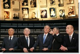 President George W. Bush listens to Avner Shalev, Chairman of the Yad Vashem Directorate, as he visits the Hall of Names in Yad Vashem, the Holocaust Museum, in Jerusalem Friday, Jan. 11, 2008. Joining the President in the visit are, from left, President Shimon Peres, of Israel; Josef Lapid, Chairman of the Yad Vashem Council, and Israel's Prime Minister Ehud Olmert. White House photo by Chris Greenberg