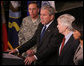 Flanked by Gen. David Petraeus, Commander of the Multi-National Force in Iraq, U.S. Ambassador to Iraq, Ryan Crocker and Secretary of State Dr. Condoleezza Rice, President George W. Bush delivers a statement Saturday, Jan. 12, 2008, during a visit to Camp Arifjan before departing Kuwait. White House photo by Eric Draper