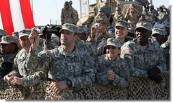 Members of the military line the path to the stage as President George W. Bush appeared Saturday, Jan. 12, 2008, at Camp Arifjan, Kuwait. An estimated 4,000 troops heard the President say "…History will say, it was when you were called upon, you served, and the service you rendered was absolutely necessary to defeat an enemy overseas so we do not have to face them here at home." White House photo by Eric Draper