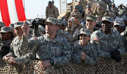 Members of the military line the path to the stage as President George W. Bush appeared Saturday, Jan. 12, 2008, at Camp Arifjan, Kuwait. An estimated 4,000 troops heard the President say "…History will say, it was when you were called upon, you served, and the service you rendered was absolutely necessary to defeat an enemy overseas so we do not have to face them here at home." White House photo by Eric Draper