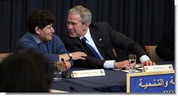 President George W. Bush leans toward Dr. Rasha Al Sabah, Kuwait's Undersecretary for Higher Education, during a roundtable discussion in Kuwait City, Saturday, Jan. 12, 2008, on democracy and development with Kuwaiti women. White House photo by Eric Draper