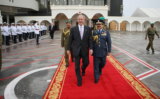 President George W. Bush and King Hamad Bin Isa Al-Khalifa walk past an honor cordon Sunday, Jan. 13, 2008, at Bahrain International Airport in Manama prior to the President's departure for Abu Dhabi, United Arab Emirates. White House photo by Eric Draper