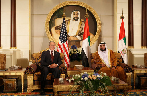 President George W. Bush and President Sheikh Khalifa bin Zayed Al Nahyan of the United Arab Emirates sit under a painting of the Sheikh's father, Sheikh Zayed bin Sultan Al Nahyan, during arrival ceremonies Sunday, Jan. 13, 2008, at Al Mushref Palace in Abu Dhabi. White House photo by Eric Draper