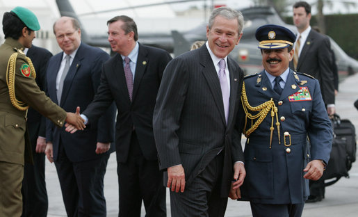 President George W. Bush walks with Bahrain's King Hamad Bin Isa Al-Khalifa at Bahrain International Airport Sunday morning, Jan. 13, 2008, as he prepares to depart Manama for the United Arab Emirates. White House photo by Chris Greenberg