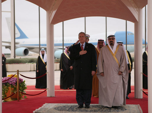 President George W. Bush and King Abdullah bin Abdul Al-Aziz stand for their national anthems Monday, Jan. 14, 2008, after the President arrived at Riyadh-King Khaled International Airport in Riyadh, Saudi Arabia. White House photo by Eric Draper