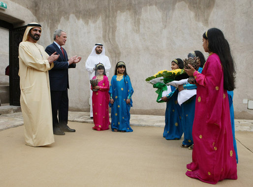 President George W. Bush and Sheikh Mohammed Bin Rashid al-Maktoum, Vice President and Prime Minister of the United Arab Emirates, applaud a children’s dance group welcoming President Bush, Monday, Jan. 14, 2008, to Sheikh Saeed Al Maktoum House in Dubai. White House photo by Eric Draper