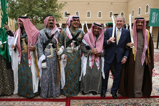 President George W. Bush and Prince Salman bin Abdul Al-Aziz, right, join sword dancers Tuesday, Jan. 15, 2008, during the President's visit to Al Murabba Palace in Riyadh. White House photo by Eric Draper