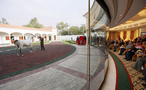 President George W. Bush and Saudi King Abdullah bin Abd al-Aziz Al Saud, right, view one of the King's prized horses from an enclosed patio Tuesday, Jan. 15, 2008 at the monarch's ranch in Al Janadriyah, Saudi Arabia. White House photo by Eric Draper