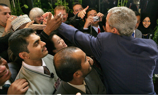 President George W. Bush reaches out to shake hands with U.S. Embassy staff and families Tuesday, Jan. 15, 2008, during his visit to Riyadh, Saudi Arabia. White House photo by Chris Greenberg