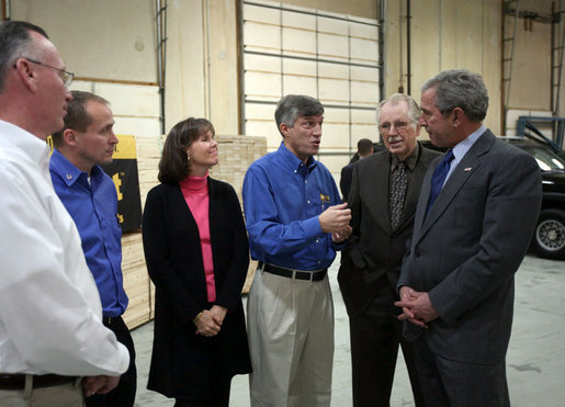 President George W. Bush listens as Bill Wright, Founder and Chief Executive Officer of Wright Manufacturing, Inc., explains the operation of the Frederick, Maryland lawn equipment business. White House photo by Joyce N. Boghosian