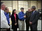 President George W. Bush listens as Bill Wright, Founder and Chief Executive Officer of Wright Manufacturing, Inc., explains the operation of the Frederick, Maryland lawn equipment business. White House photo by Joyce N. Boghosian