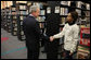 President George W. Bush speaks with a volunteer, thanking her for her service, during a visit to the Martin Luther King, Jr., Memorial Library Monday, Jan. 21, 2008 in Washington, D.C., to commemorate Martin Luther King, Jr., Day. White House photo by Eric Draper