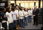 President George W. Bush speaks with volunteers, thanking them for their service, during a visit to the Martin Luther King, Jr., Memorial Library Monday, Jan 21, 2008, in Washington, D.C., in commemoration of Martin Luther King, Jr., Day. White House photo by Eric Draper