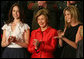 Mrs. Laura Bush, joined by her daughters, Barbara, left, and Jenna applaud from the First Lady's box at the U.S. Capitol, as President George W. Bush delivers his State of the Union Address Monday, Jan. 28, 2008. White House photo by Joyce N. Boghosian