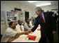 President George W. Bush shakes hands with a participant in the Jericho Program while visiting a classroom Tuesday, Jan. 29, 2008, in Baltimore. Serving men 18 years and older who have been released from prison within the last 6 months and who have never been convicted of a violent offense, the program helps them rebuild their lives while fostering a new sense of self-worth and a commitment to productive, healthy lifestyles. White House photo by Joyce N. Boghosian