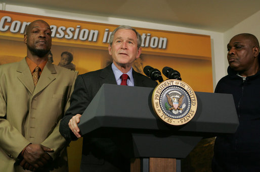 President George W. Bush stands next to graduates Adolphus Mosely, left, and Thomas Boyd, as he delivers remarks after visit the faith-based Jericho Program Tuesday, Jan. 29, 2008, in Baltimore. Said the President, "I've come to look firsthand at the Jericho Program, which is helping former prisoners make a successful transition back to society. There's no more important goal than to help good souls become -- come back to our society as productive citizens. I'm honored to have been with those who have worked hard to deal with their circumstances in such a way that they become productive citizens. I'm standing next to two such men, and I met probably seven others downstairs." White House photo by Joyce N. Boghosian