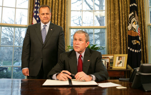 President George W. Bush, joined by Office of Management and Budget Director Jim Nussle, talks with reporters prior to signing an executive order Tuesday, Jan. 29, 2008 in the Oval Office, protecting American taxpayers from government spending on wasteful earmarks. White House photo by Eric Draper