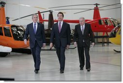 President George W. Bush tours the Robinson Helicopter Company Wednesday, Jan. 30, 2008 in Torrance, Calif., joined by California Governor Arnold Schwarzenegger and CEO Frank Robinson. Following the tour President Bush addressed employees and members of the media on the nation’s economy and the importance of free trade agreements. White House photo by Eric Draper