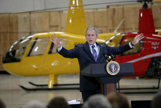 President George W. Bush gestures as he addresses his remarks on the economy and the benefits of free trade, following his tour of the Robinson Helicopter Company Wednesday, Jan. 30, 2008 in Torrance, Calif. White House photo by Eric Draper