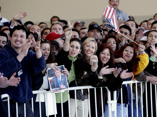 Employees at the Robinson Helicopter Company cheer President George W. Bush, Wednesday, Jan. 30, 2008 in the Torrance, Calif., where President Bush toured the facility and spoke about the nation’s economy and the importance of free trade agreements. White House photo by Eric Draper