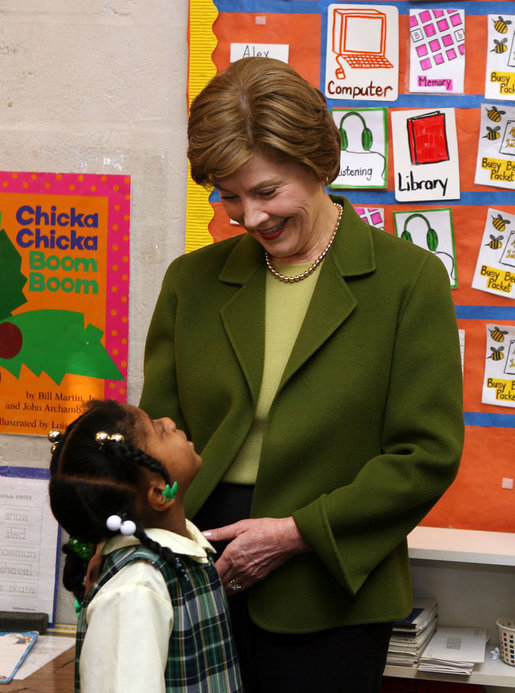 Mrs. Laura Bush listens to a kindergarten student during her visit at Holy Redeemer School Wednesday, Jan. 30. 2008. White House photo by Shealah Craighead