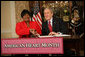 President George W. Bush shakes the hand of Joyce Cullen, a heart disease survivor, after signing the Presidential Proclamation in Honor of American Heart Month Friday, Feb. 1, 2008, in Kansas City, Mo. In signing the proclamation, the President thanked Mrs. Cullen for her work and said, ".She's very much a part of the Heart Truth Campaign here in Kansas City. And she's helping people understand two things -- one, be able to recognize the symptoms, and secondly, be able to prevent the symptoms from happening in the first place. So I want to thank you for being a strong leader in the campaign for awareness." White House photo by Eric Draper