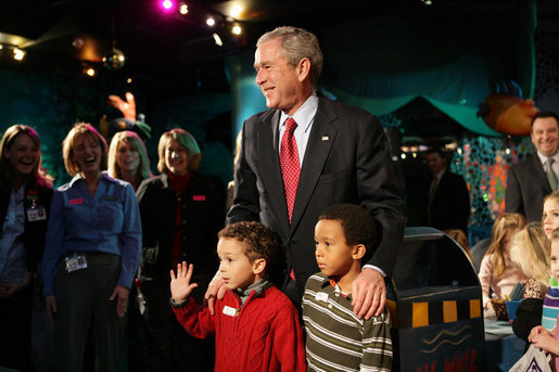 President George W. Bush pauses to talk Friday, Feb. 1, 2008, with Eli Lockhart, left, and Alex Harris, both 6 years old, at the Kaleidoscope Creative Center at Hallmark Cards, Inc., in Kansas City, Mo. White House photo by Eric Draper