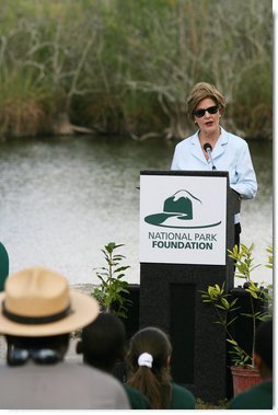 Mrs. Laura Bush addresses students and guests Wednesday, Feb. 6, 2008, during the Junior Ranger "First Bloom" planting event in Everglades National Park, Florida, praising a program to help bring back native trees in areas of the Everglades overgrown with non-native plants. White House photo by Shealah Craighead