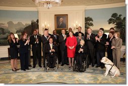 Mrs. Laura Bush participates in a photo opportunity with Jim Nussle, Director, Office of Management and Budget and employee of the year government workers from the AbilityOne 2007-2008 workforce Monday, Feb. 11, 2008, in the Diplomatic Room at the White House. White House photo by Shealah Craighead