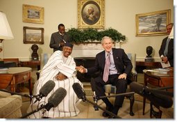 President George W. Bush and Mali President Amadou Touré meet in the Oval Office Tuesday, Feb. 12, 2008, at the White House. Said President Bush upon welcoming his fellow leader, "I was touched by the President's concern about the life of the average citizen in Mali. This is a country that's committed to the rights of its people, and we're proud to be standing side-by-side with you."  White House photo by Eric Draper