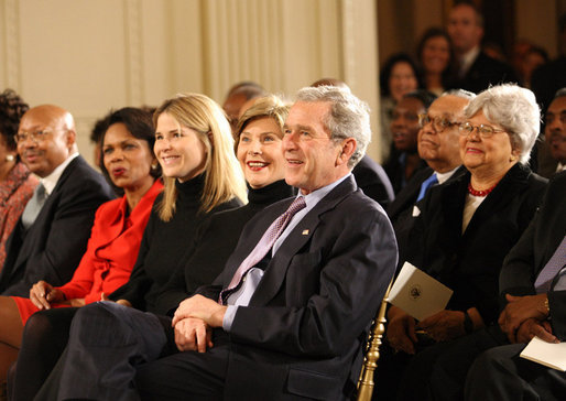 President George W. Bush, Mrs. Laura Bush, Jenna Bush and Secretary of State Condoleezza Rice join the East Room audience in listening to The Temptations Tuesday, Feb. 12, 2008, during a celebration of African American History Month. White House photo by Eric Draper