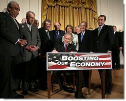 President George W. Bush signs H.R. 5140, the Economic Stimulus Act of 2008, Wednesday, Feb. 13, 2008, in the East Room at the White House. White House photo by David Bohrer