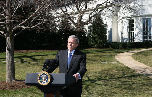 President George W. Bush talks with reporters Thursday, Feb. 14. 2008 on the South Lawn of the White House, urging members of Congress to pass the Protect America Act before legislation authorizing the monitoring of terrorist communications expires Saturday at midnight. White House photo by Chris Greenberg