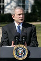 President George W. Bush talks with reporters Thursday, Feb. 14. 2008 on the South Lawn of the White House, urging members of Congress to pass the Protect America Act before legislation authorizing the monitoring of terrorist communications expires Saturday at midnight. White House photo by Chris Greenberg