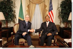 President George W. Bush and President Jakaya Kikwete of Tanzania shake hands before the start of their meeting Sunday, Feb. 17, 2008, at the State House in Dar es Salaam. White House photo by Eric Draper