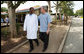 President George W. Bush walks with Dr. Aziz Msuya Monday, Feb. 18, 2008, during a tour of the Meru District Hospital outpatient clinic in Arusha, Tanzania. White House photo by Eric Draper